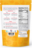 The back of a stand-up pouch package, showing nutrition facts, suggested uses, recipes, and a barcode, with orange tropical mango illustrations on a white background.